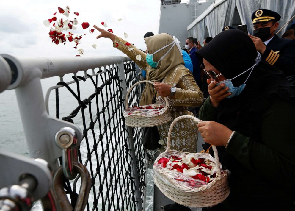 PHOTO: Family members of the passengers of Sriwijaya Air Flight 182 react while throwing flowers from the deck of the Indonesian Navy's KRI Semarang ship as they visit the site of the crash at sea, off the coast of Jakarta, Indonesia, on Jan. 22, 2021.