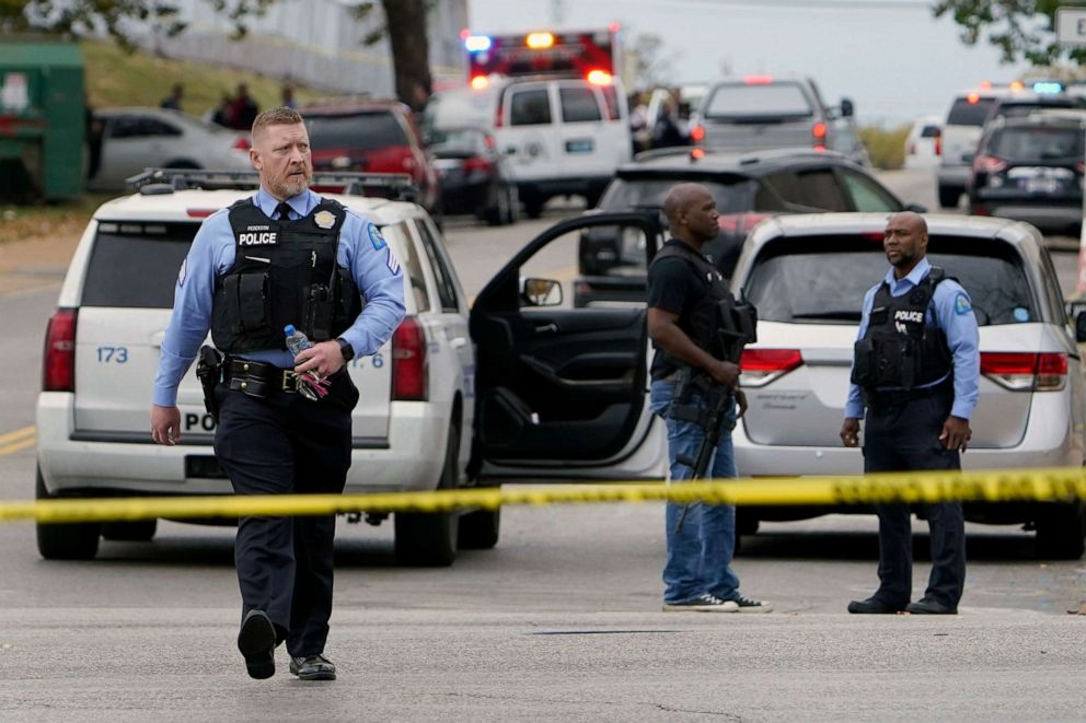 PHOTO: Law enforcement investigates the scene of a shooting at the High School of Visual and Performing Arts, on Oct.  24, 2022, St.  Louis.