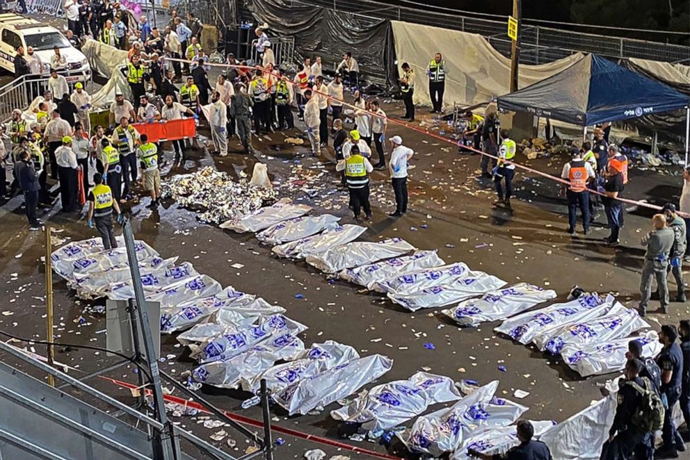 PHOTO: Security officials and rescuers gather near the bodies of victims who died in a stampede overnight during a religious gatheringin northern Israel, during a religious gathering.