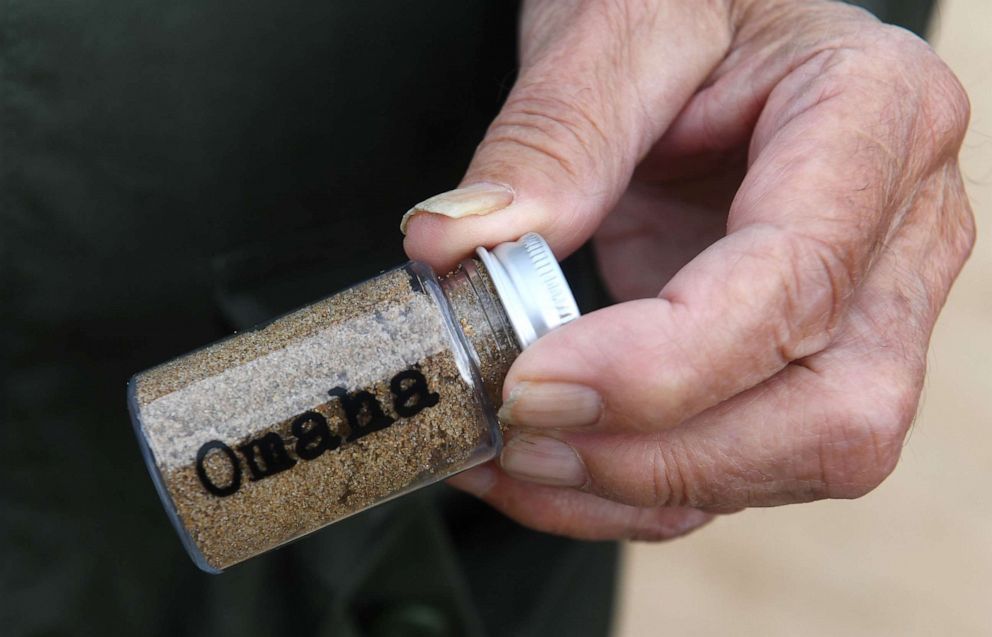 PHOTO: US WWII veteran Stan Friday, from Pennsburg, Pa., hold a bottle of sand from Omaha Beach on June 5, 2019, as part of D-Day commemorations marking the 75th anniversary of the World War II Allied landings in Normandy. 