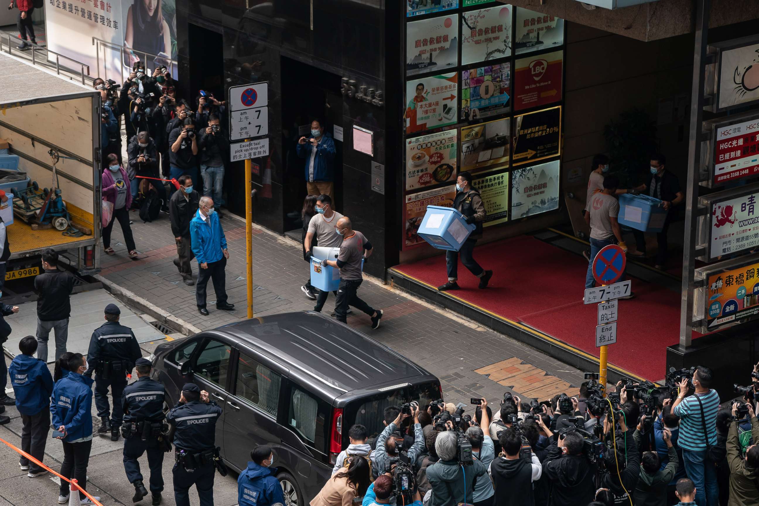 PHOTO: Boxes are loaded onto a truck from the offices of Stand News after police searched the premises of the independent news outlet, Dec. 29, 2021, in Hong Kong.