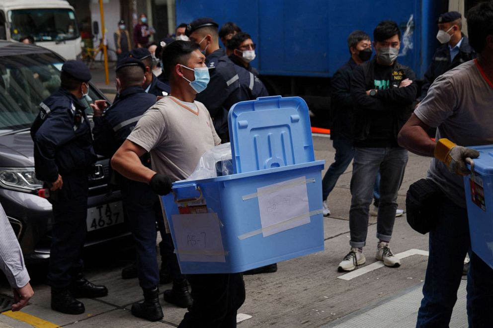 PHOTO: A worker carries a box of evidence from the offices of Stand News in Hong Kong, Dec. 29, 2021, after police raided the office of the local media outlet.