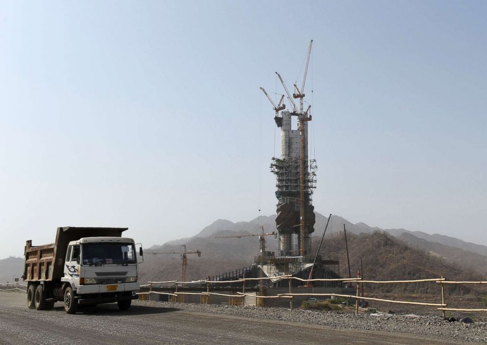 PHOTO: This photograph taken on April 18, 2018 shows the under-construction "Statue Of Unity," a monument dedicated to Indian independence leader Sardar Vallabhbhai Patel, overlooking the Sardar Sarovar Dam near Vadodara in India's western Gujarat state.