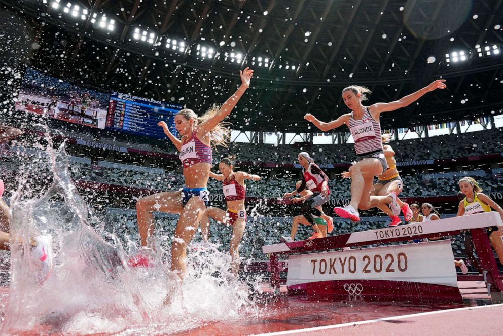 PHOTO: Runners compete in the heats of the women's 3,000-meters steeplechase at the 2020 Summer Olympics, Sunday, Aug. 1, 2021, in Tokyo.