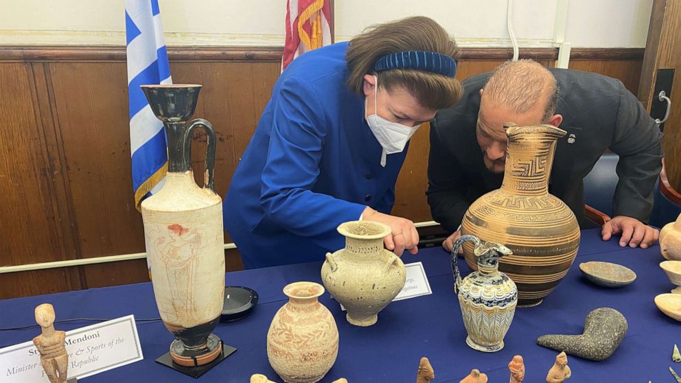 PHOTO: Greek Minister of Culture Lina Mendoni examines stolen antiquities at a repatriation ceremony at the Manhattan District Attorney's office in New York, on Feb. 23, 2022.
