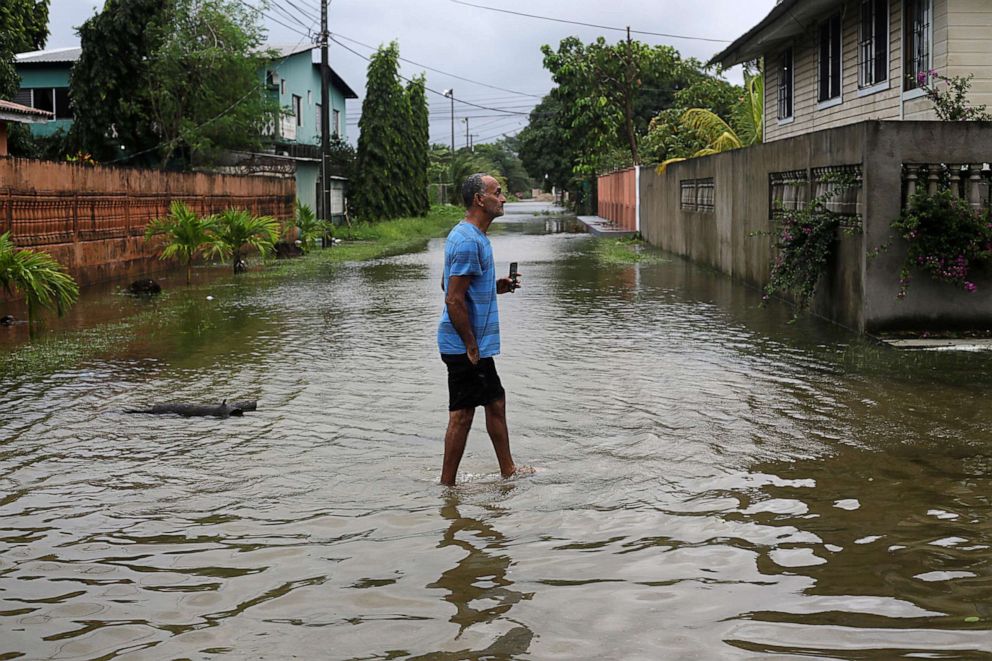 PHOTO: A resident checks a flooded street as Hurricane Eta approaches in Tela, Honduras, Nov. 3, 2020.