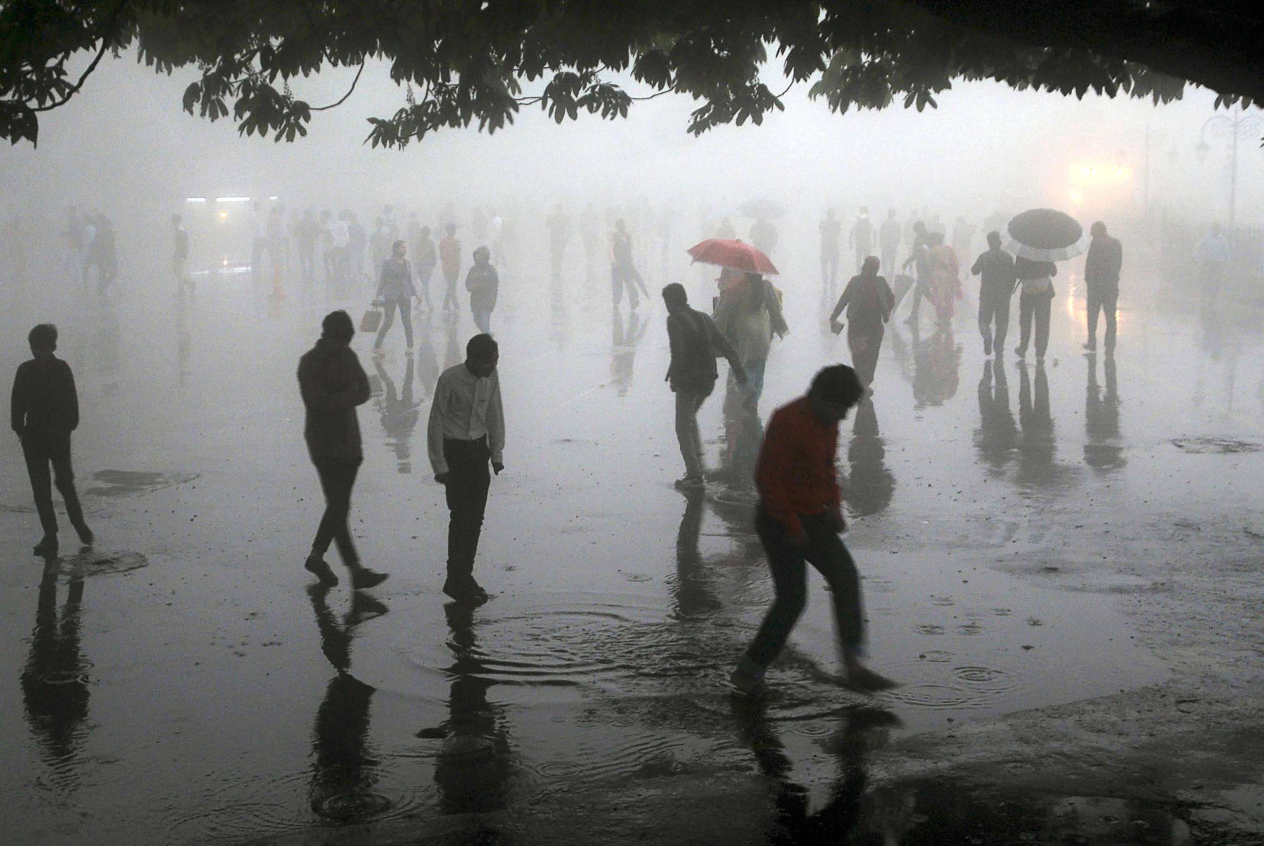 PHOTO: People walking under heavy rainfall in the northern hill town of Shimla in Himachal Pradesh state, India, May 2, 2018. 77 people were killed, 143 injured in powerful storms across northern India overnight on May 2-3, officials said.