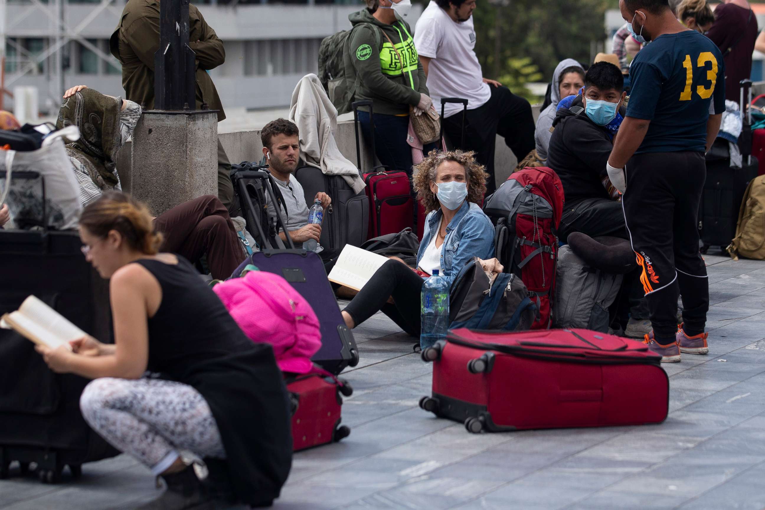 PHOTO: Passengers waits for a charter flight coordinated by the U.S. embassy at La Aurora airport in Guatemala City, March 23, 2020. American citizens stranded abroad because of the coronavirus pandemic are seeking help in returning to the United States.