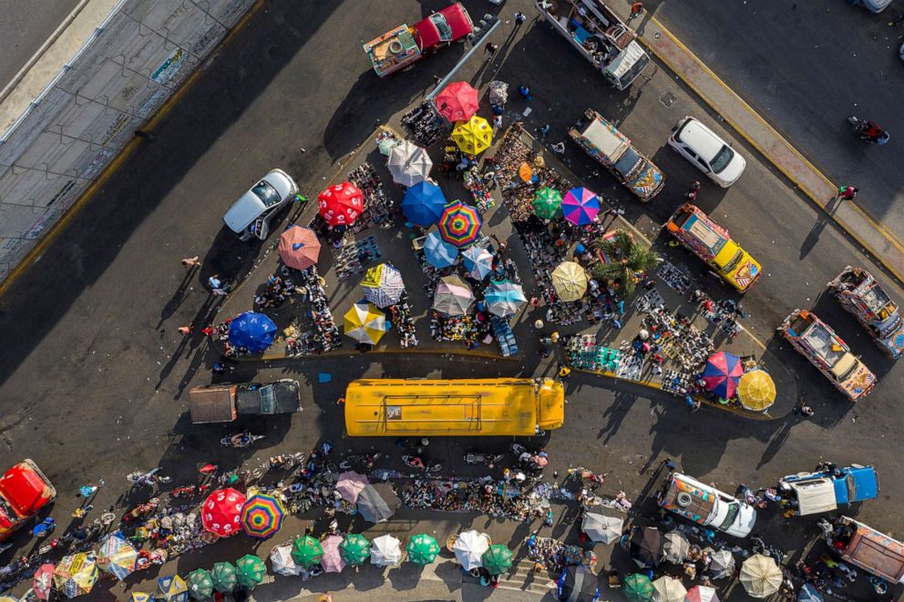 PHOTO: An aerial view shows people buying goods in a street market in Port-au-Prince, Haiti, on July 10, 2021, following the assassination of President Jovenel Moise.