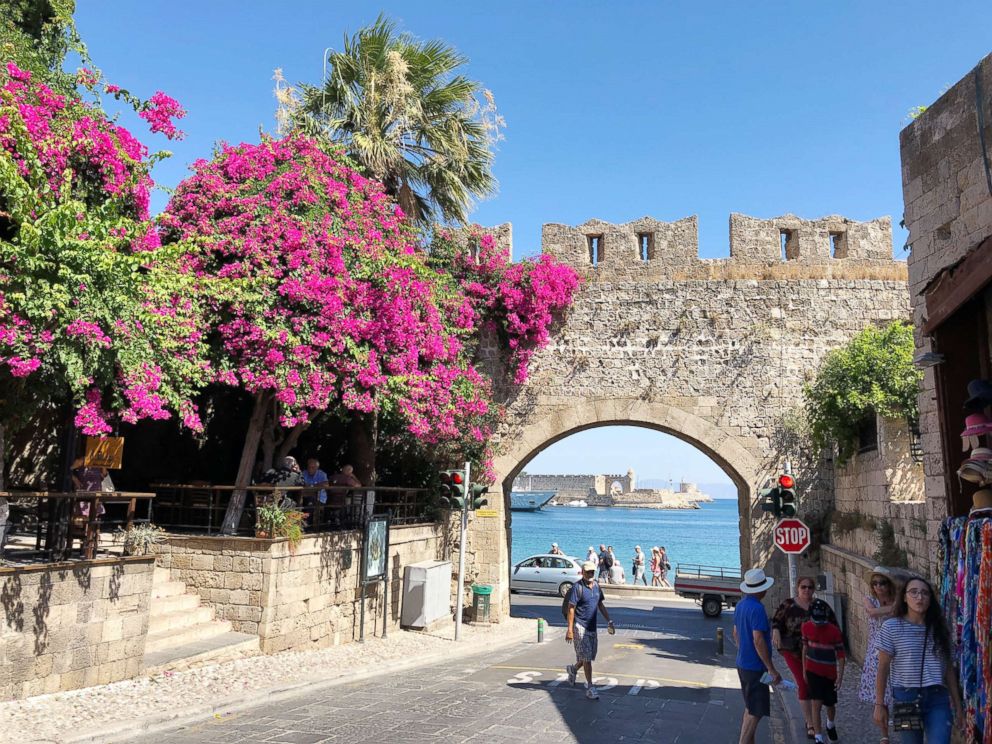 PHOTO: Tourists walk on the streets of the Old Town, one of the largest walled complexes in Europe. 