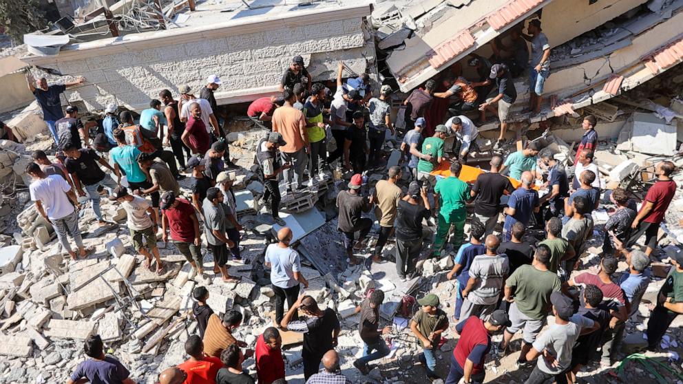 PHOTO: People and emergency crews look for survivors following Israeli bombardment on the Al-Nassr school that houses displaced Palestinians, West of Gaza city, on Aug. 4, 2024, amid the ongoing conflict between Israel and the militant Hamas group. 