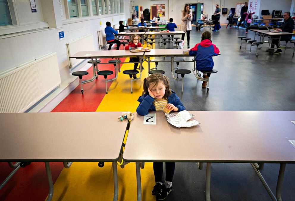 PHOTO: The children of essential workers comply with social distancing rules in the cafeteria of a hub school for Edinburgh city center pupils at Drummond Community High School, Edinburgh, April 28, 2020.