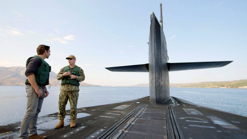 PHOTO: ABC News and "World News Tonight" anchor David Muir speaks with Rear Adm. William Houston on top of U.S. Navy guided missile submarine USS Florida on the Mediterranean Sea.