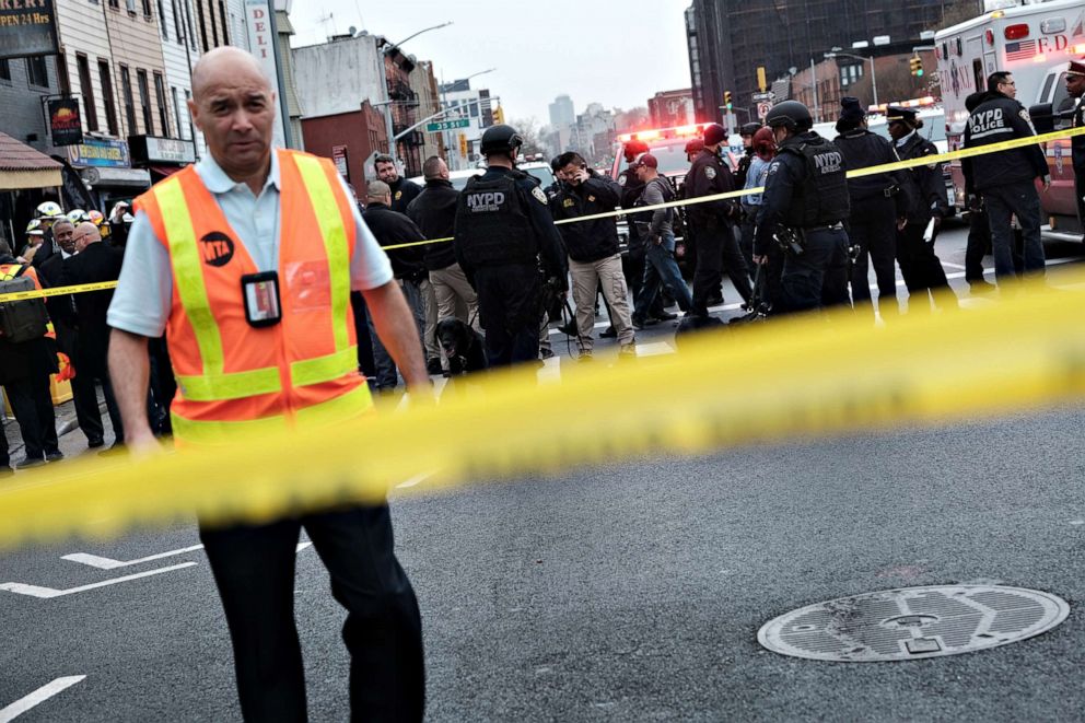 PHOTO: Police, emergency responders and MTA workers gather at the site of a reported shooting of multiple people outside of the 36 St subway station on April 12, 2022 in the Brooklyn borough of New York City.