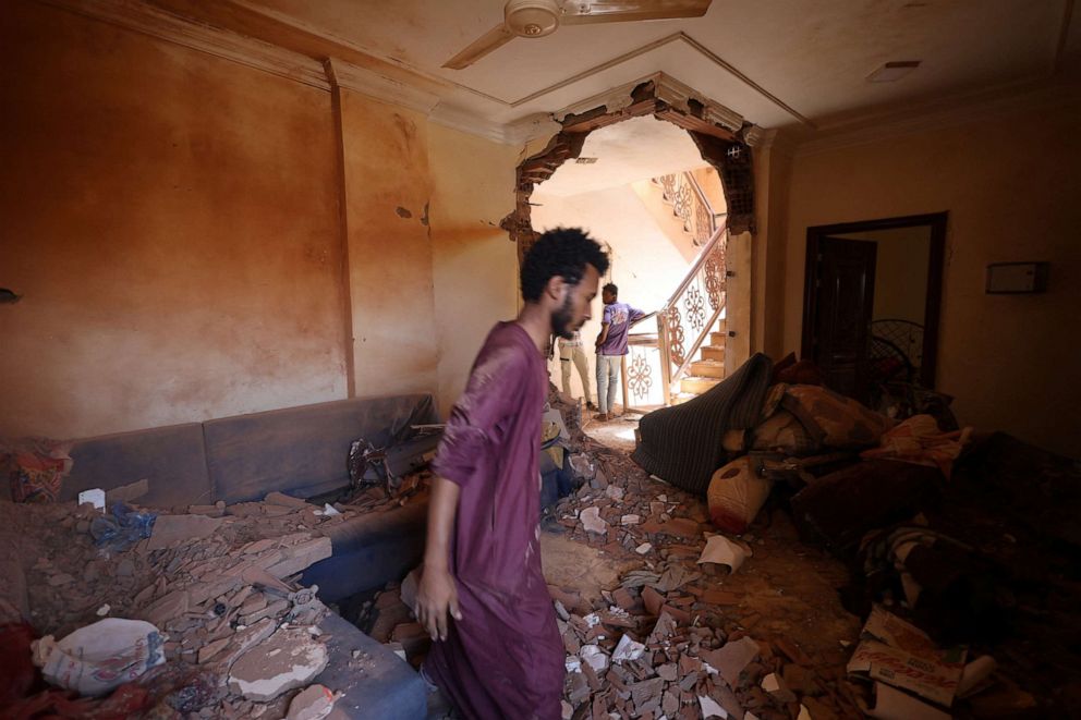 PHOTO: A man looks at the damage inside a house in Khartoum, Sudan, April 17, 2023.