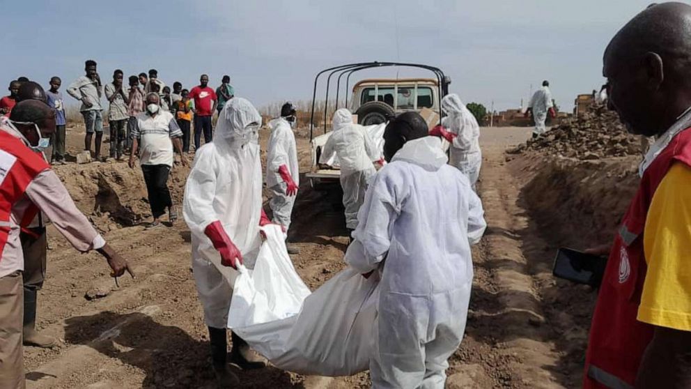 PHOTO: Members of the Sudanese Red Crescent Society work with volunteers to move bodies at Al-Shaqilab Cemetery in Khartoum, Sudan, in a photo taken on May 10, 2023, and released by the society.