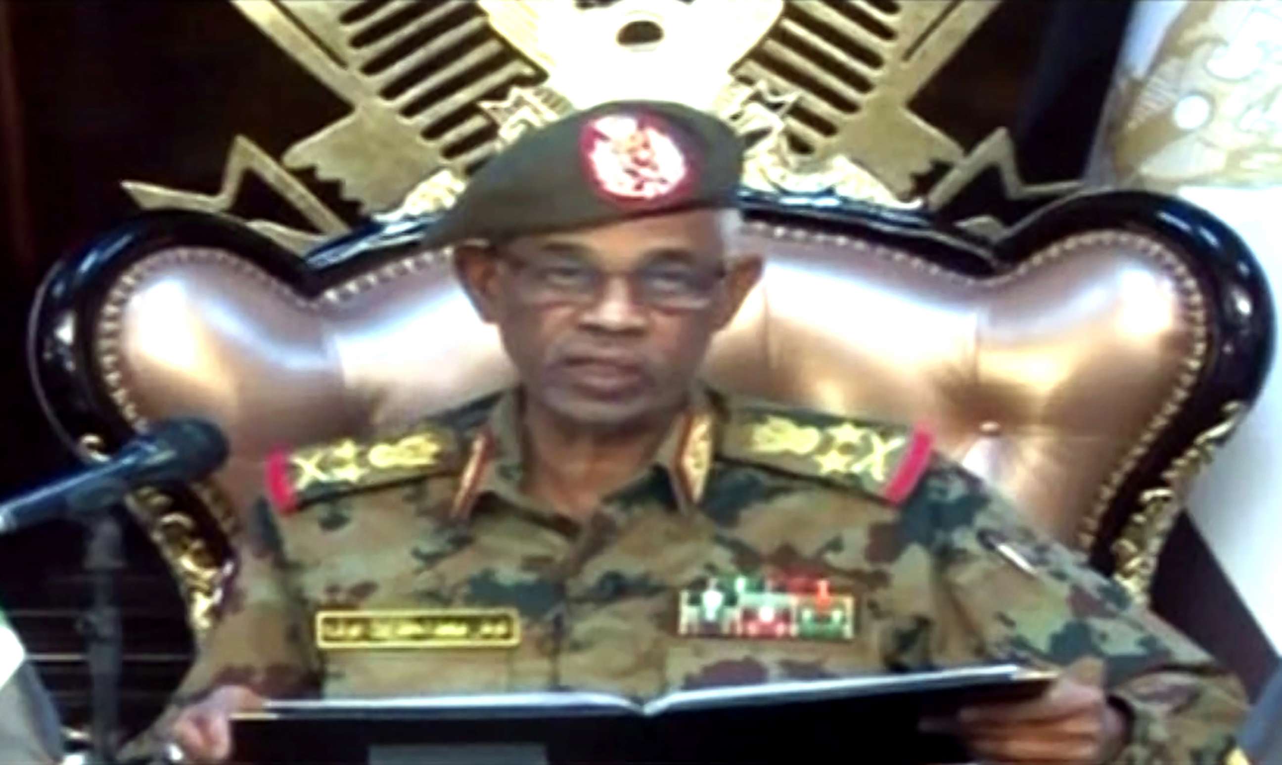 PHOTO: A grab from a live broadcast on Sudan TV shows Sudanese Defence Minister Ahmed Awad Ibnouf delivering a speech in Khartoum, announcing that President Omar al-Bashir was removed from power on April 11, 2019.