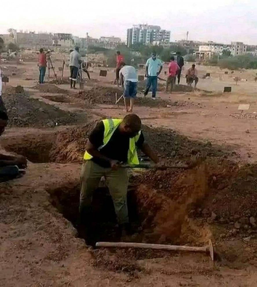 PHOTO: Volunteers dig graves in Sudan, amid a bloody conflict that's killed hundreds, in a photo taken by Dr. Noah Madni near Khartoum on April 25, 2023.