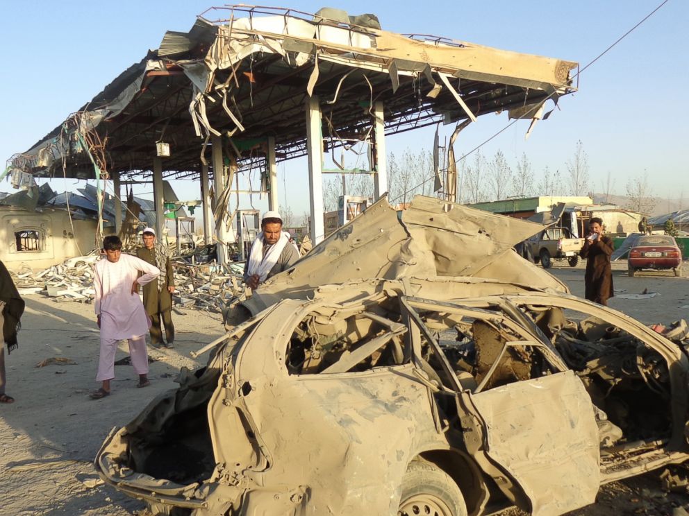 PHOTO: People survey the destruction caused at the scene of a suicide bomb attack that targeted a Police post, in Paktia, Afghanistan, Oct. 17, 2017.