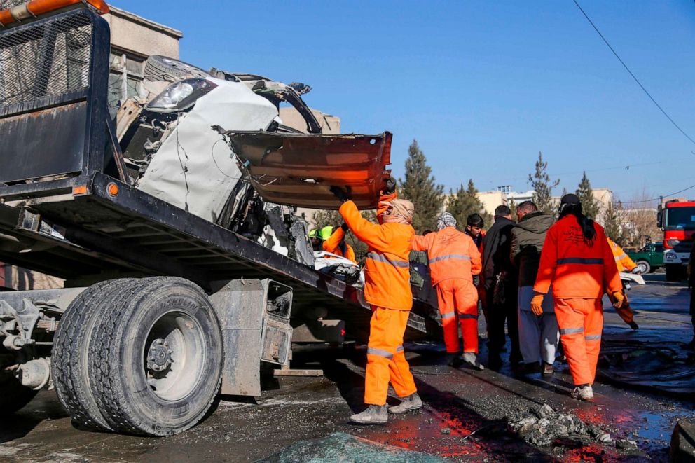 PHOTO: Municipal workers clean up debris at the site of a bomb attack in Kabul, Afghanistan, Dec. 22, 2020.