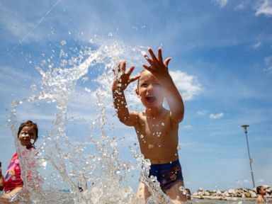 PHOTO: A young boy plays in Lake Balaton in Balatonfenyves, Hungary, June 10, 2019.