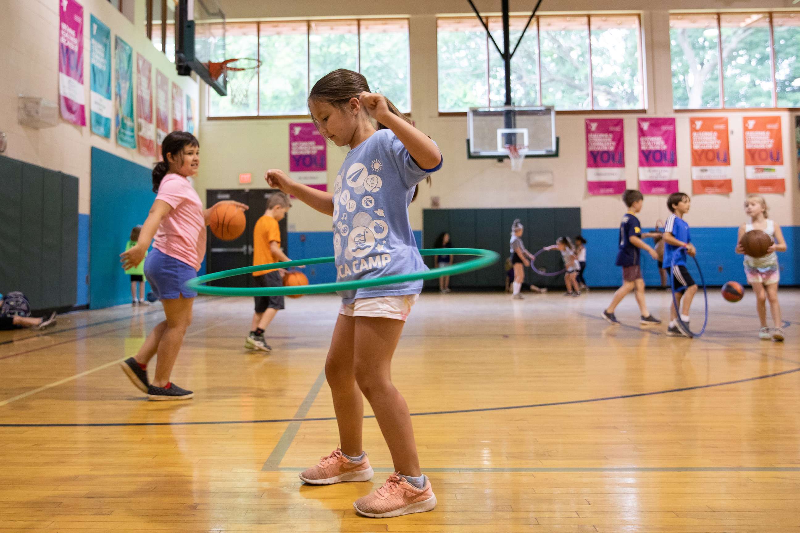 PHOTO: In this June 23, 2020, file photo, children play in the gym amid the coronavirus disease outbreak, at Carls Family YMCA summer camp in Milford, Mich.