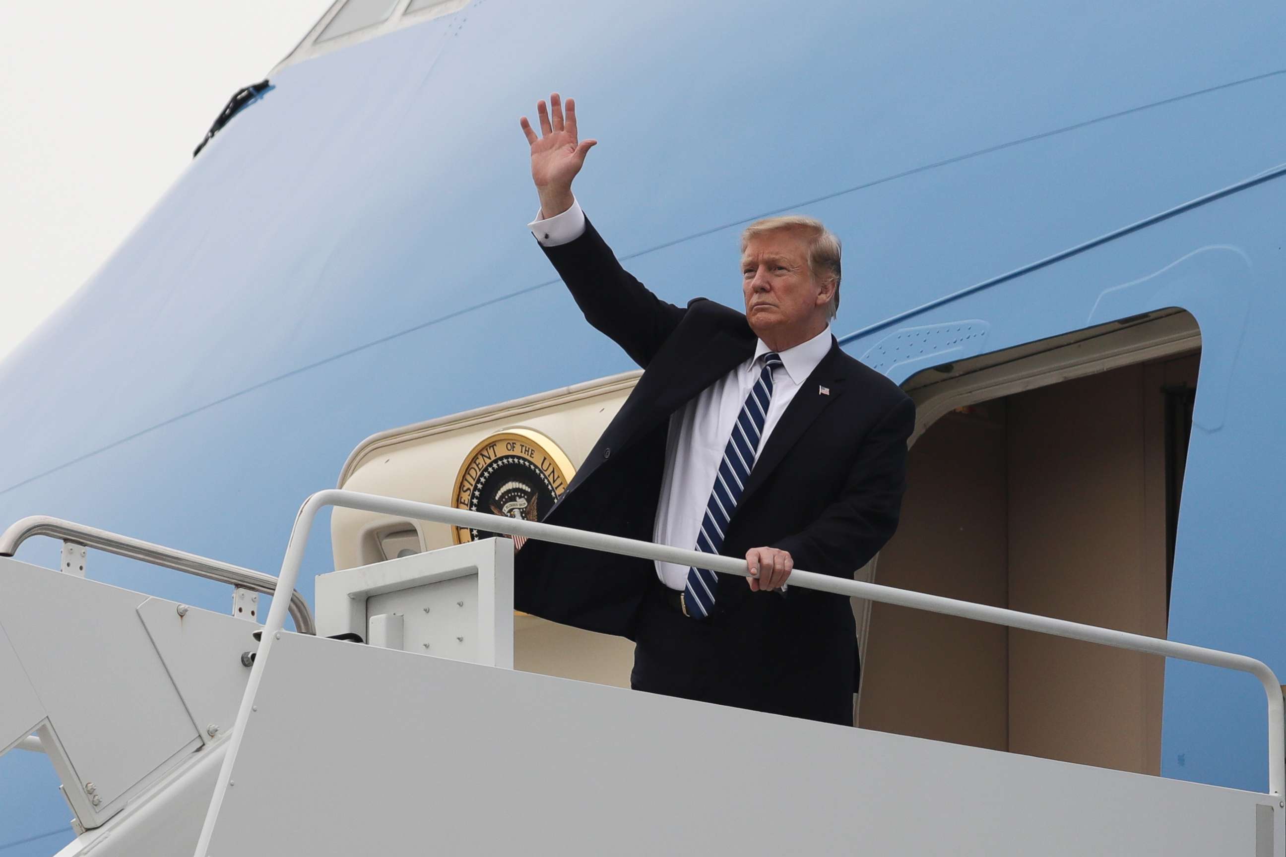 PHOTO: President Donald Trump waves as he boards Air Force One after a summit with North Korean leader Kim Jong Un, Feb. 28, 2019, in Hanoi, Vietnam.