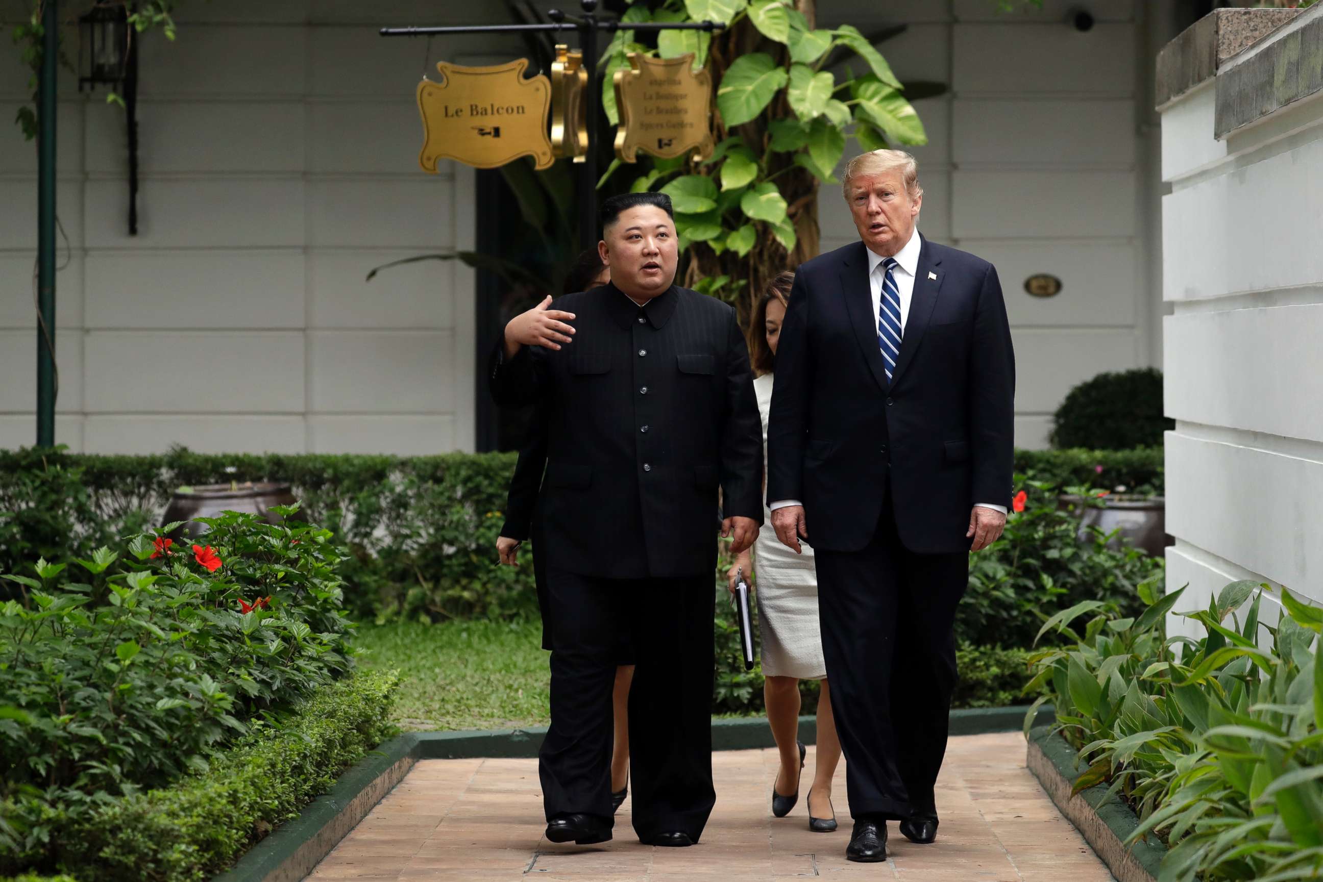 PHOTO: President Donald Trump and North Korean leader Kim Jong Un take a walk after their first meeting at the Sofitel Legend Metropole Hanoi hotel, Feb. 28, 2019, in Hanoi.