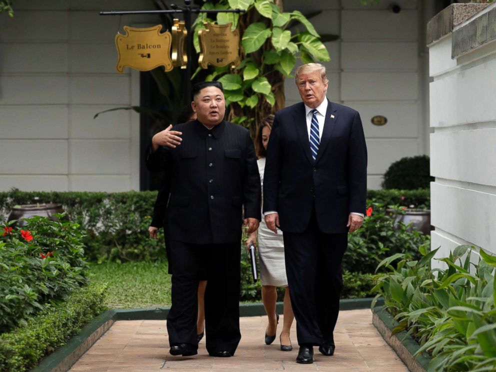 PHOTO: President Donald Trump and North Korean leader Kim Jong Un take a walk after their first meeting at the Sofitel Legend Metropole Hanoi hotel, Feb. 28, 2019, in Hanoi.