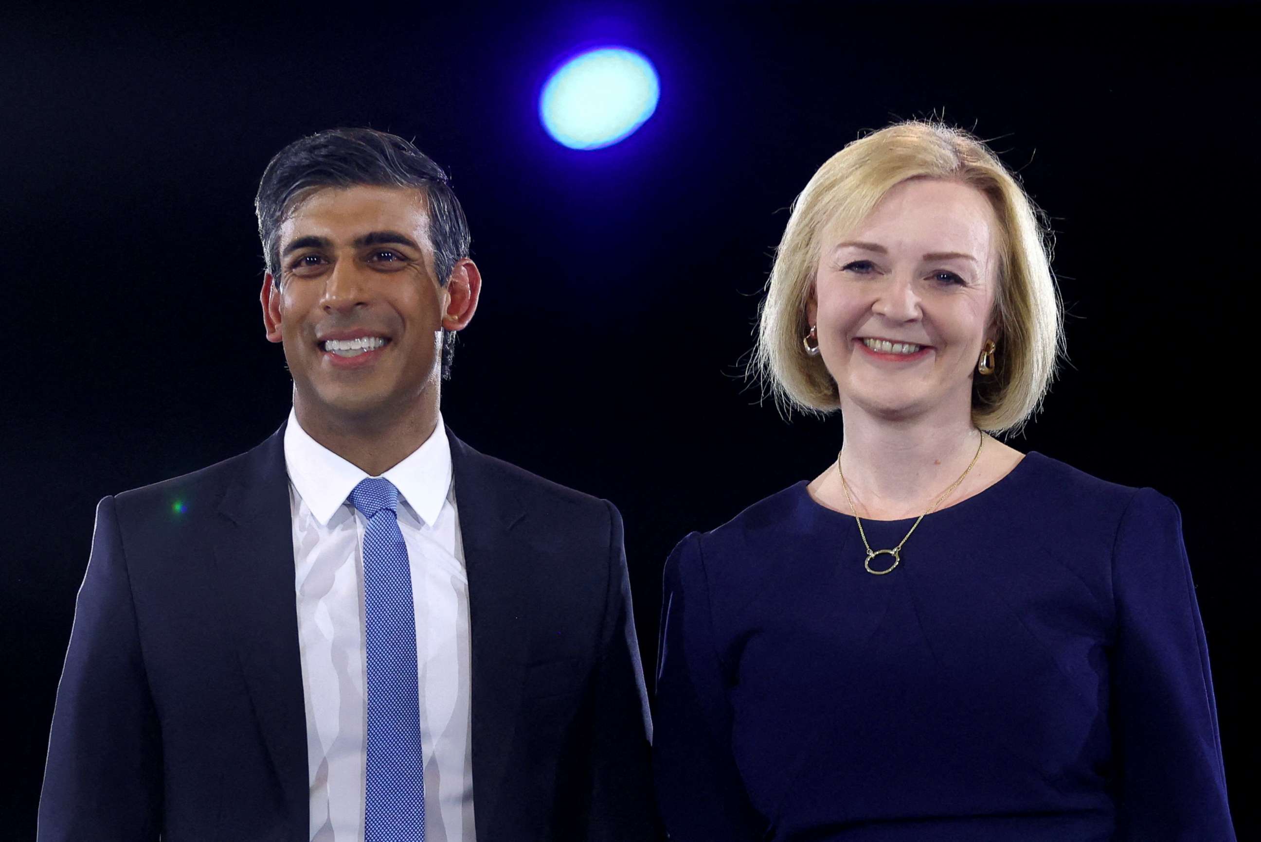 PHOTO: Conservative leadership candidates Liz Truss and Rishi Sunak stand together as they attend a hustings event, part of the Conservative party leadership campaign, in London, Britain August 31, 2022.