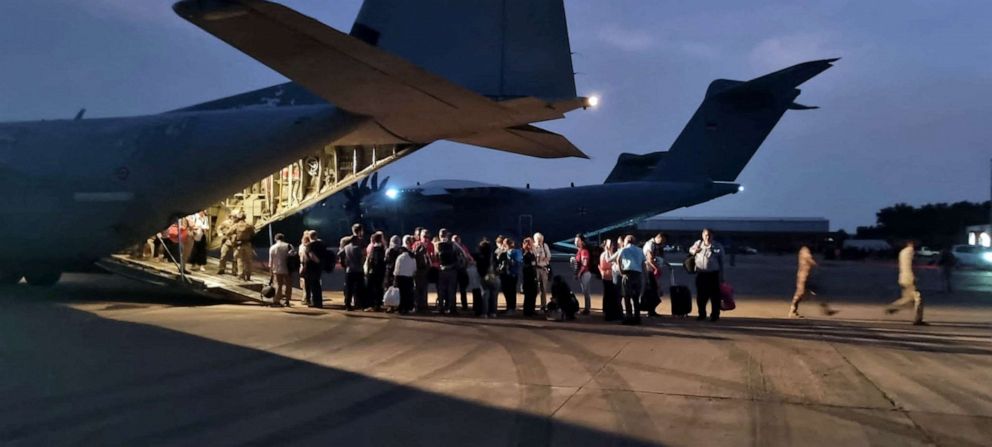 PHOTO: Italian citizens board an Italian Air Force C130 aircraft during their evacuation from Khartoum, Sudan, in this undated photo obtained by Reuters, April 24, 2023.