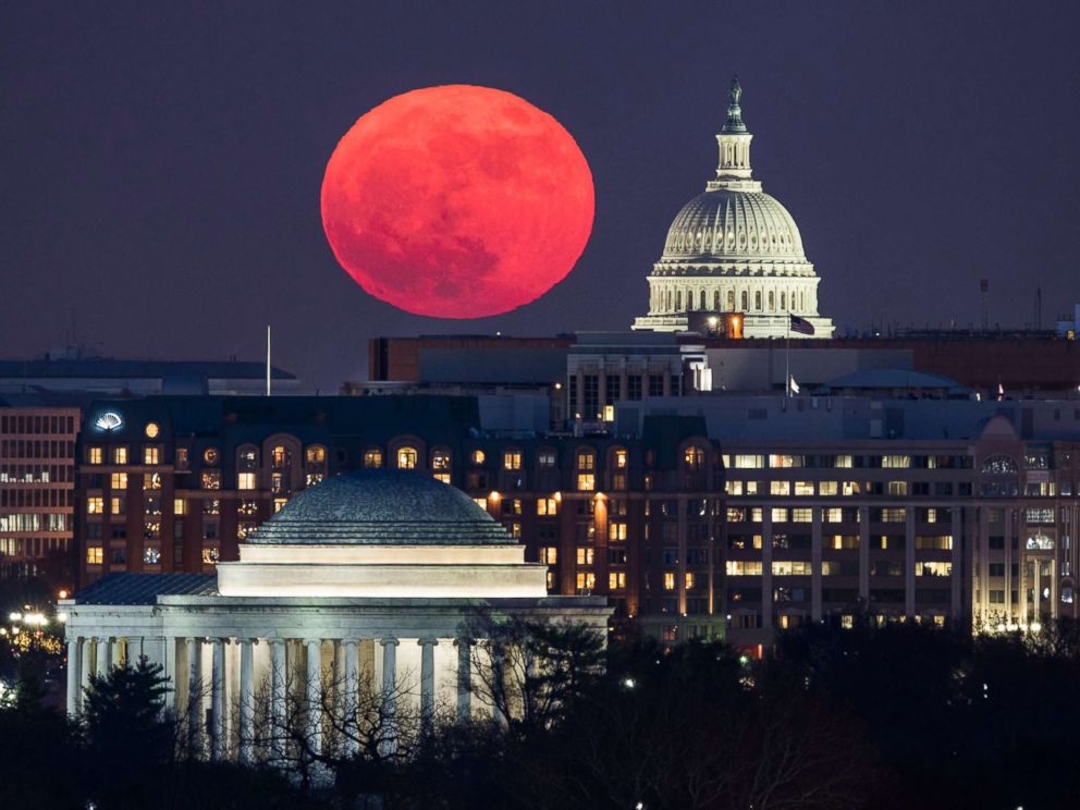 PHOTO: A supermoon rises behind the US Capitol and the Jefferson Memorial, in Washington, DC, viewed from Arlington, Virginia, Dec. 3, 2017.