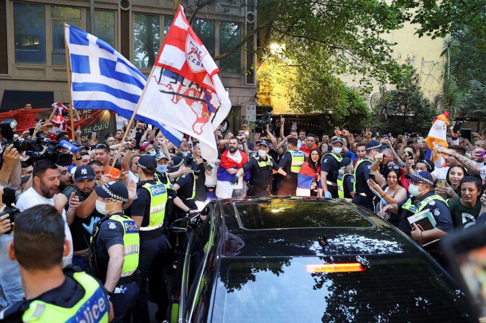 PHOTO: Supporters of Serbian tennis player Novak Djokovic gather around a car outside what is believed to be the location of his lawyer's office in Melbourne, Australia, Jan. 10, 2022.