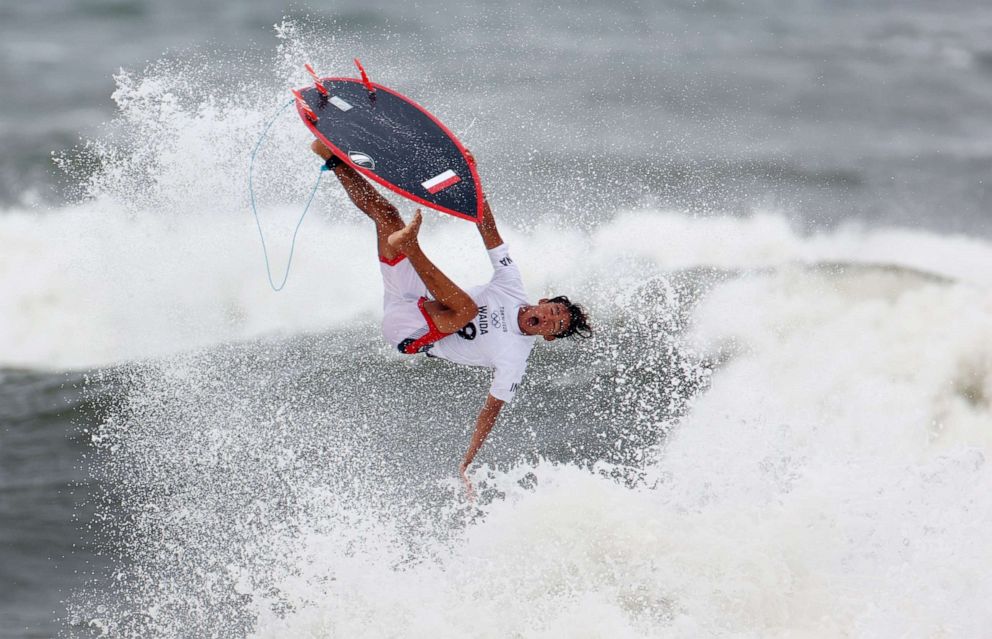 PHOTO: Rio Waida of Indonesia launches off a wave in the first heat of the men's shortboard competition on July 26, 2021 in Tokyo.
