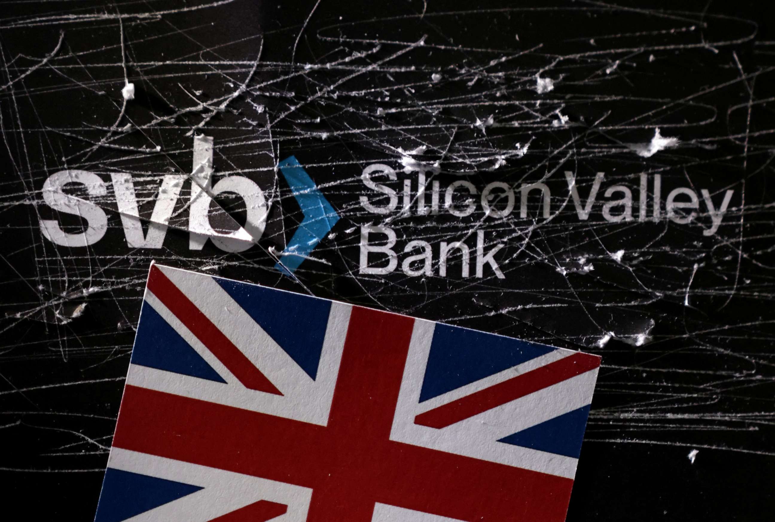 PHOTO: Destroyed Silicon Valley Bank logo and UK flag is seen in this illustration taken March 13, 2023.