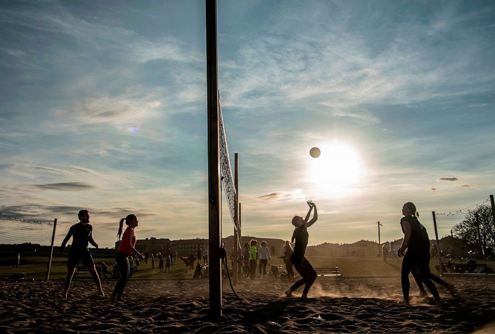 PHOTO: People play beach volleyball at Gardet park/recreation area, amid the coronavirus disease (COVID-19) outbreak, in central Stockholm, Sweden, April 20, 2020.