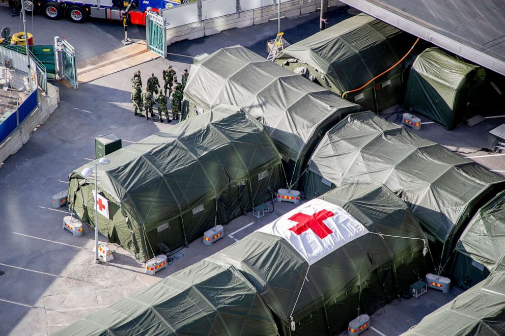 PHOTO: Military personnel prepare a field hospital at the Ostra Sjukhuset hospital area in Gothenburg, Sweden, March 24, 2020. 