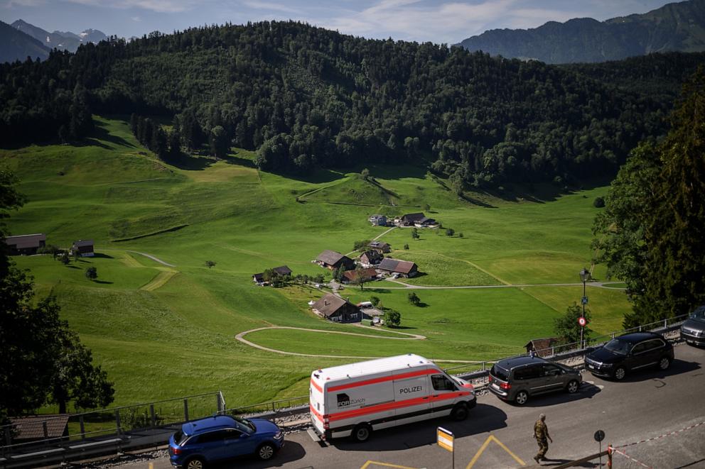 PHOTO: A police car is parked near a hamlet close to the Burgenstock luxury hotel complex overlooking Lake Lucerne, Switzerland, on June 21, 2026, ahead of high-level talks aimed at advancing a deal to end the Middle East conflict.