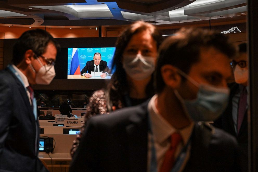 PHOTO: Ambassadors and diplomats leave the room while Russia's foreign minister Sergei Lavrov addresses with a pre-recorded video message the Conference on Disarmament in Geneva, March 1, 2022.