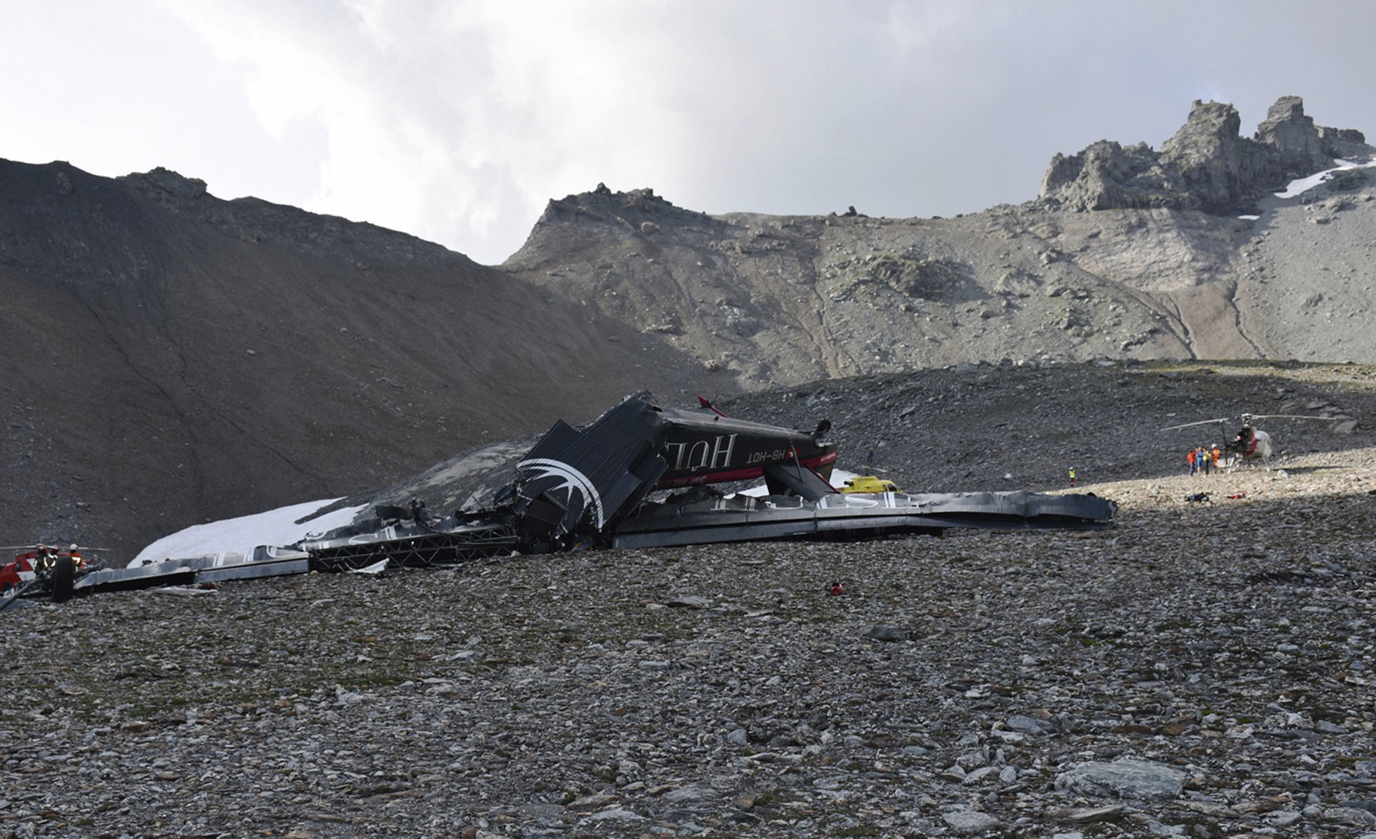 The wreckage of the old-time propeller plane Ju 52 after it went down went down, Aug. 4, 2018, on the Piz Segnas mountain above the Swiss Alpine resort of Flims, striking the mountain's western flank about 8,330 feet above sea level, in Switzerland.