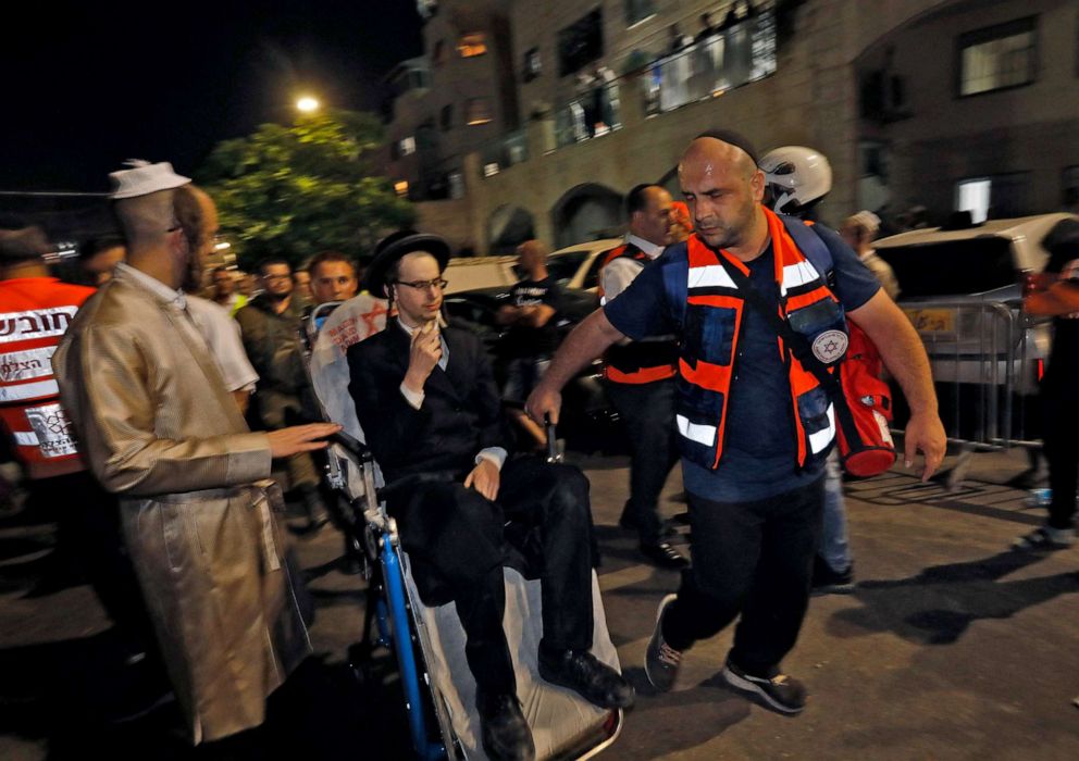 PHOTO: Israeli medics evacuate an injured ultra-Orthodox Jewish man after the collapse of grandstand seating at a synagogue in Givat Zeev in Jerusalem, May 16, 2021.