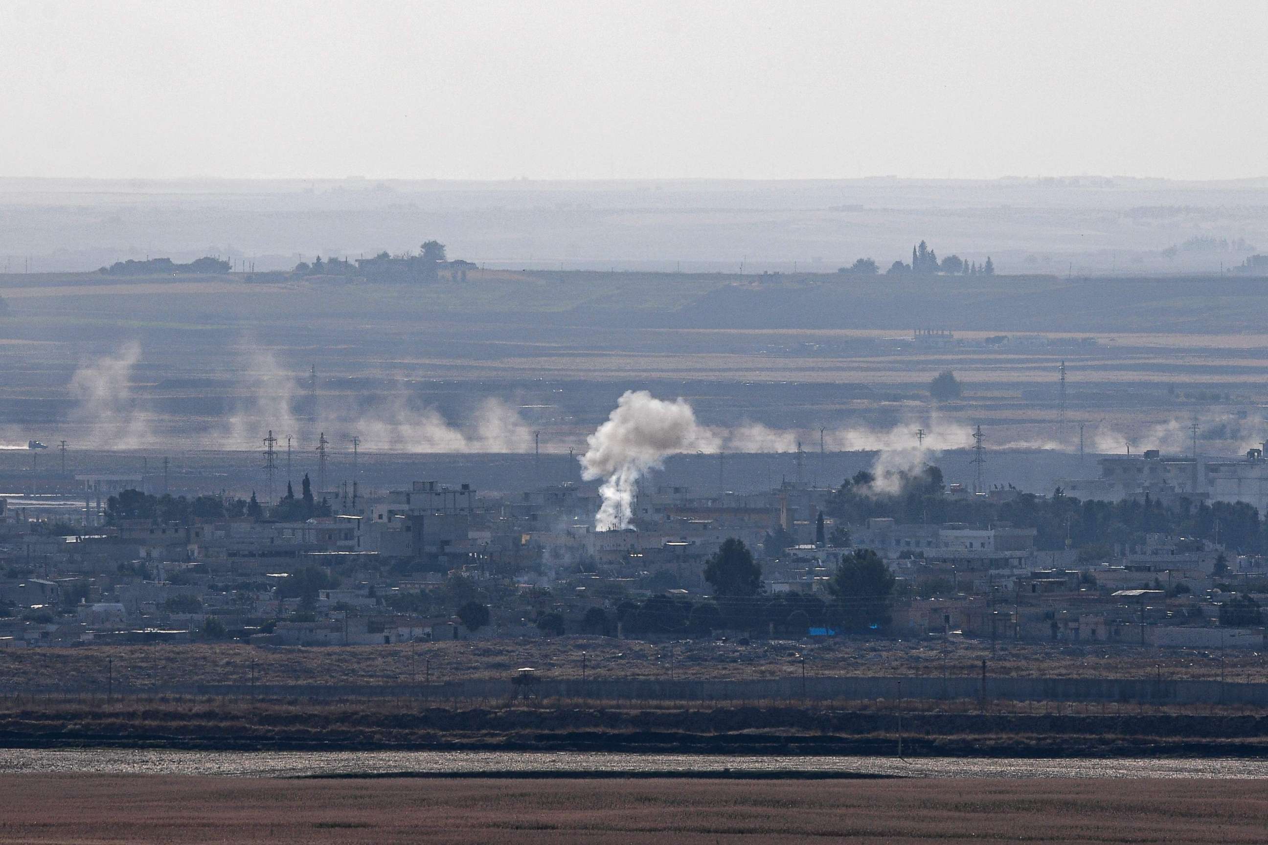 PHOTO: This picture taken on October 18, 2019 from the Turkish side of the border in Ceylanpinar shows smoke rising from the Syrian town of Ras al-Ain on the first week of Turkey's military operation against Kurdish forces.