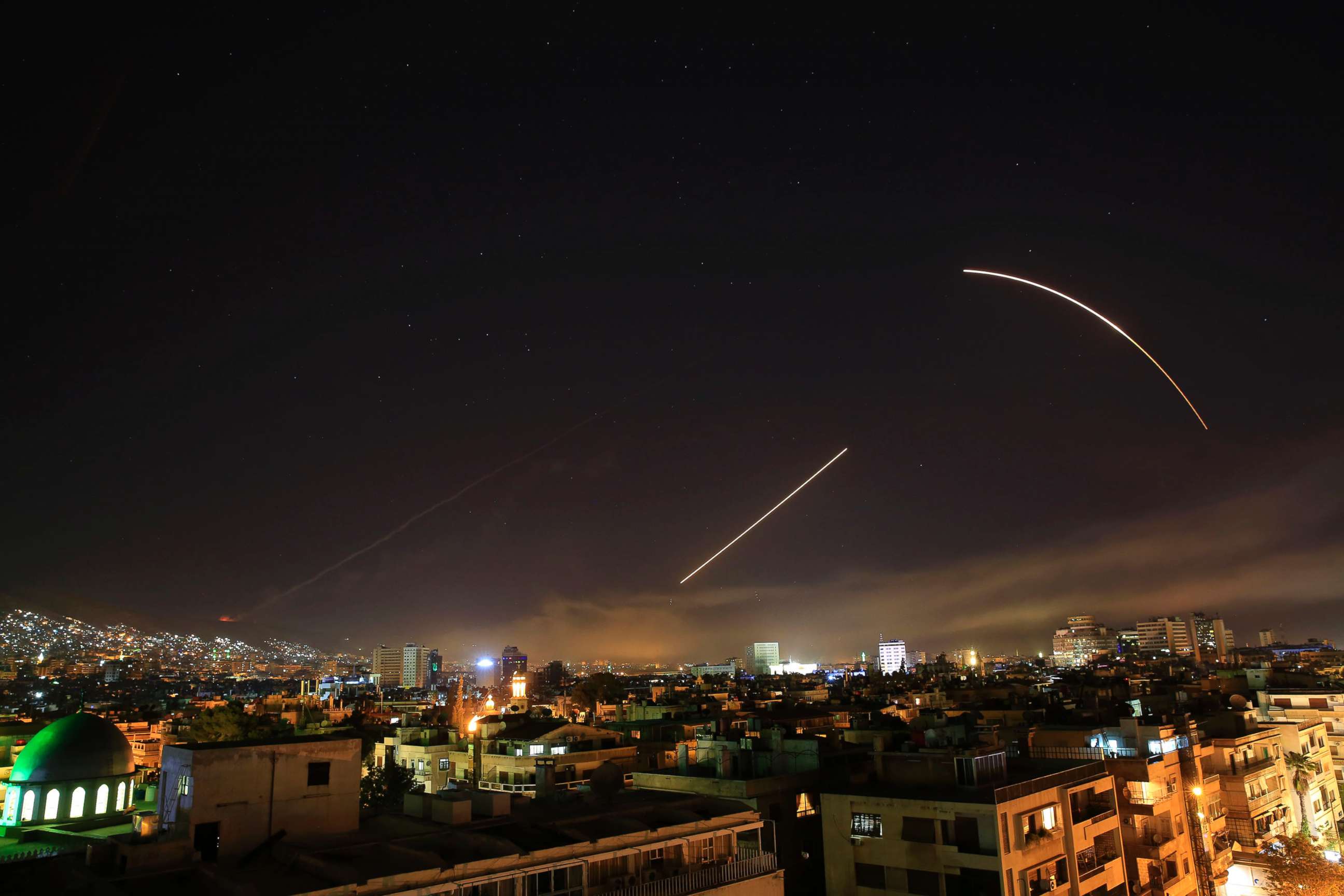 PHOTO: Missiles streak across the Damascus skyline as the U.S. launches an attack on Syria targeting different parts of the capital, early Saturday, April 14, 2018.