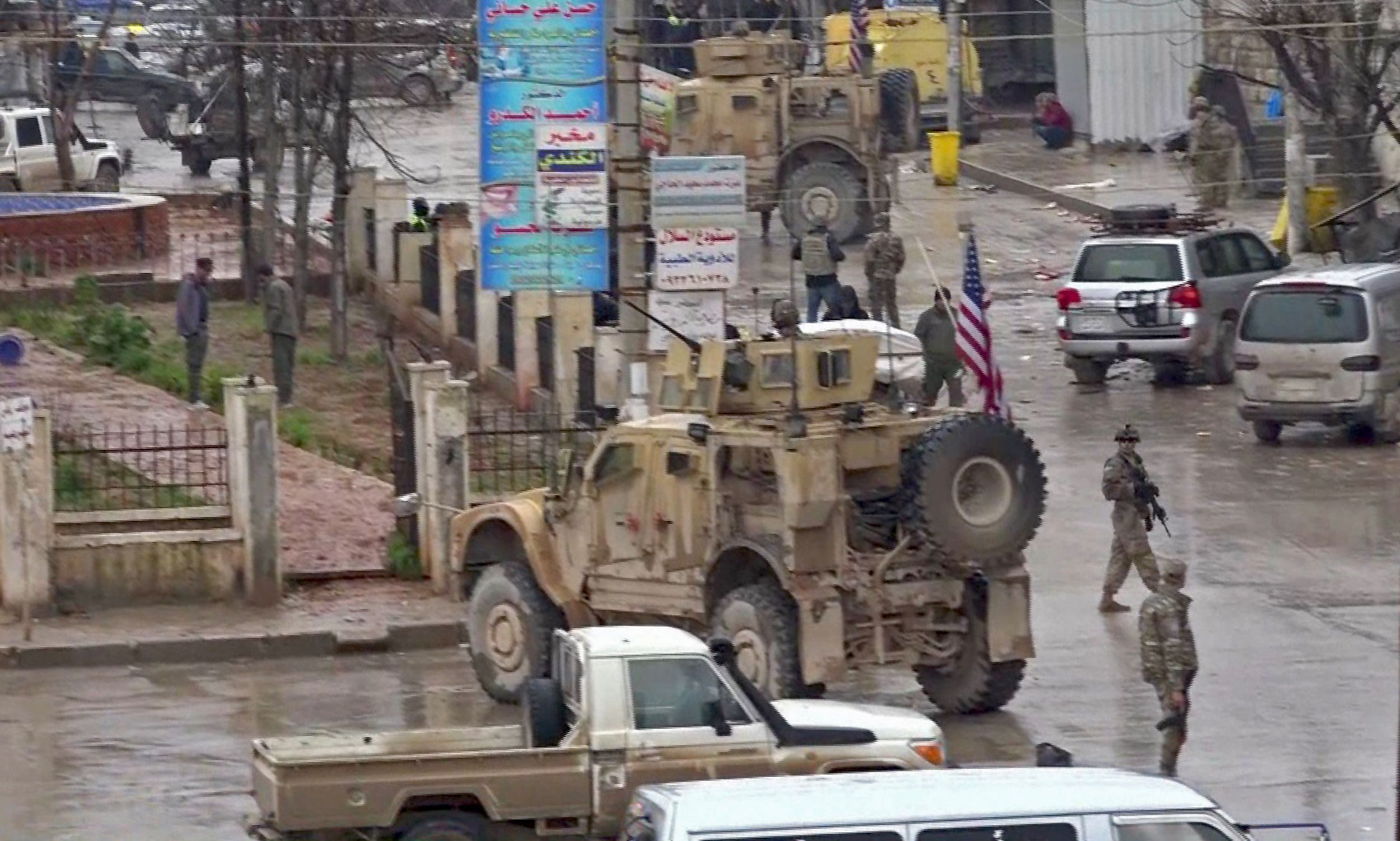 PHOTO: An image grab taken from a video obtained by AFPTV on Jan. 16, 2019, shows U.S. troops gathered at the scene of a suicide attack in the northern Syrian town of Manbij.