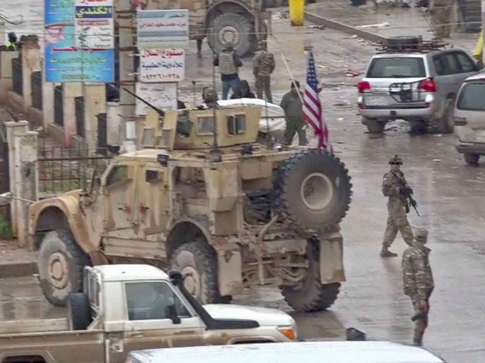 PHOTO: An image grab taken from a video obtained by AFPTV on Jan. 16, 2019, shows U.S. troops gathered at the scene of a suicide attack in the northern Syrian town of Manbij.