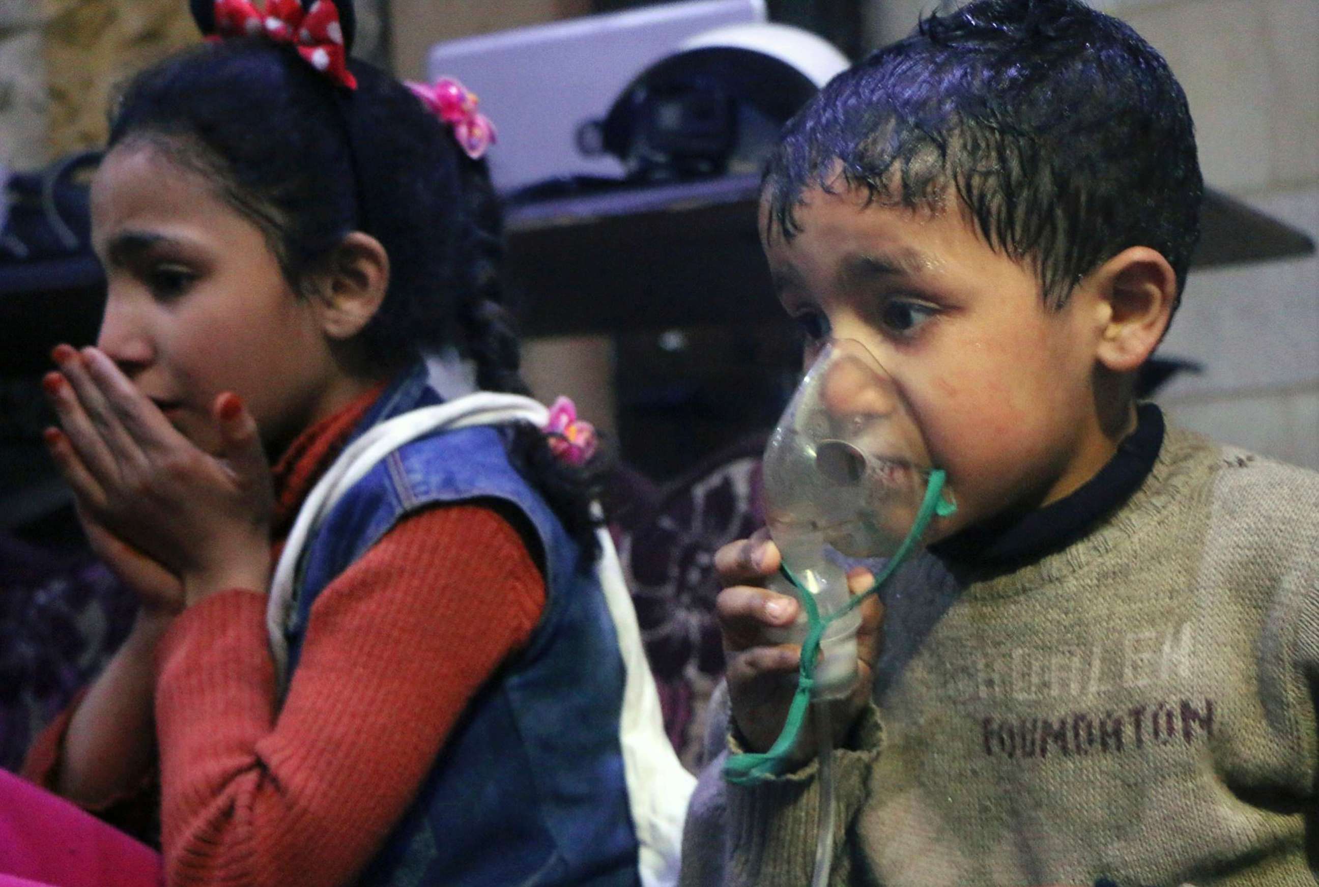 PHOTO: This image released early Sunday, April 8, 2018 by the Syrian Civil Defense White Helmets, shows a child receiving oxygen through respirators following an alleged poison gas attack in the rebel-held town of Douma, near Damascus, Syria.