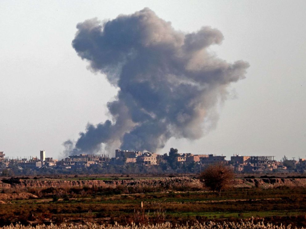 PHOTO: Smoke billows after bombings in the Deir Ezzor province, near Hajin, eastern Syria, on Dec. 15, 2018.