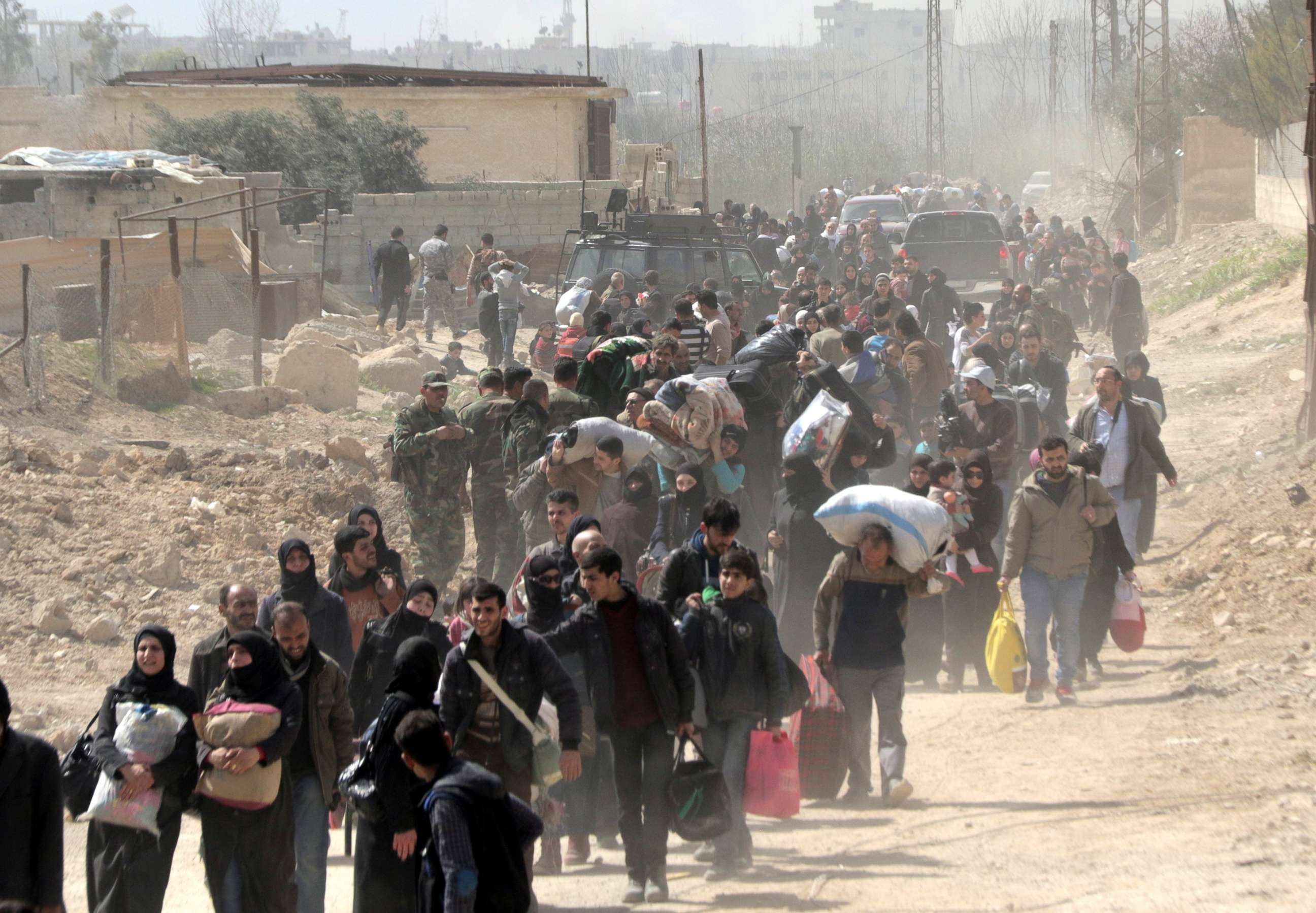 PHOTO: Hundreds of civilians leave rebels-held Eastern Ghouta in the countryside of Damascus, Syria, March 15, 2018.