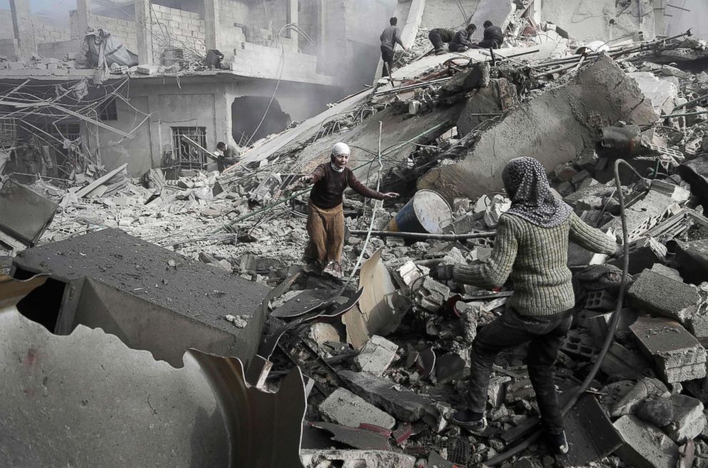 PHOTO: Sisters run across the rubble to embrace after finding each other alive following an air strike in the besieged rebel-held Eastern Ghouta near Damascus, Jan. 9, 2018.