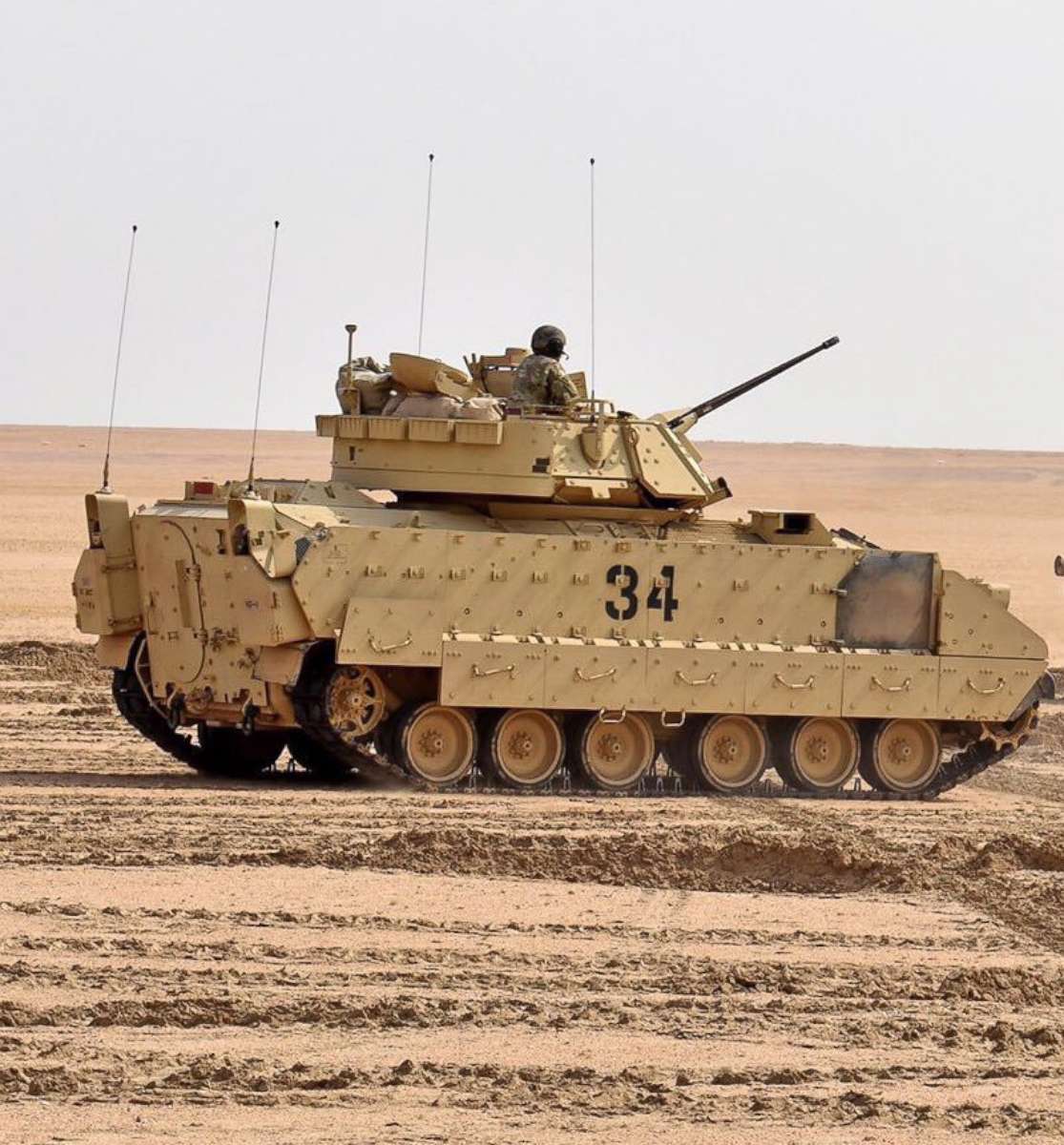 PHOTO: U.S. soldiers load M2A2 Bradley Fighting Vehicles headed to Deir ez Zor, Syria as part of a new U.S. troop deployment to defend the oil fields in that region.